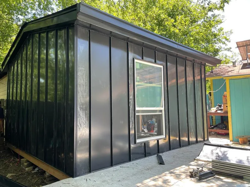 Black standing seam metal wall panels for Metal Roof Installation in Calumet